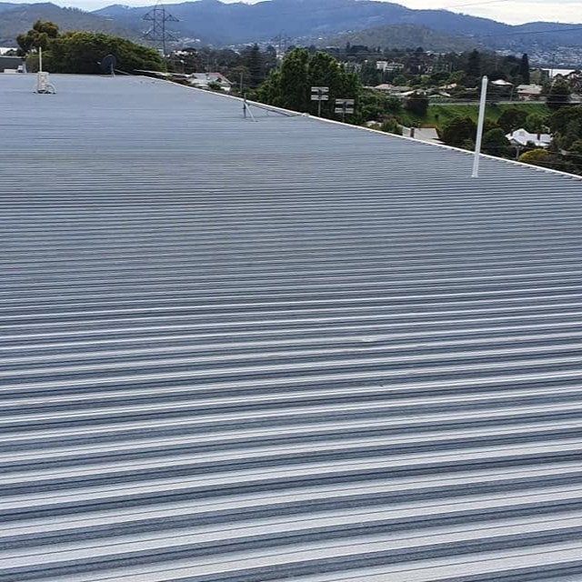 Roof tile cleaning before and after
