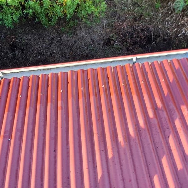 Roof tile coating application